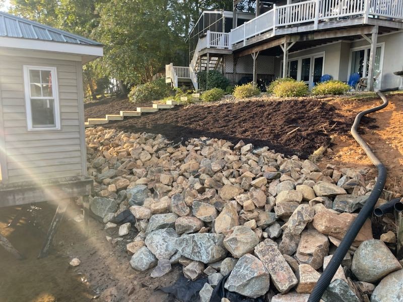 SHT Construction — riprap seawall and shoreline grading